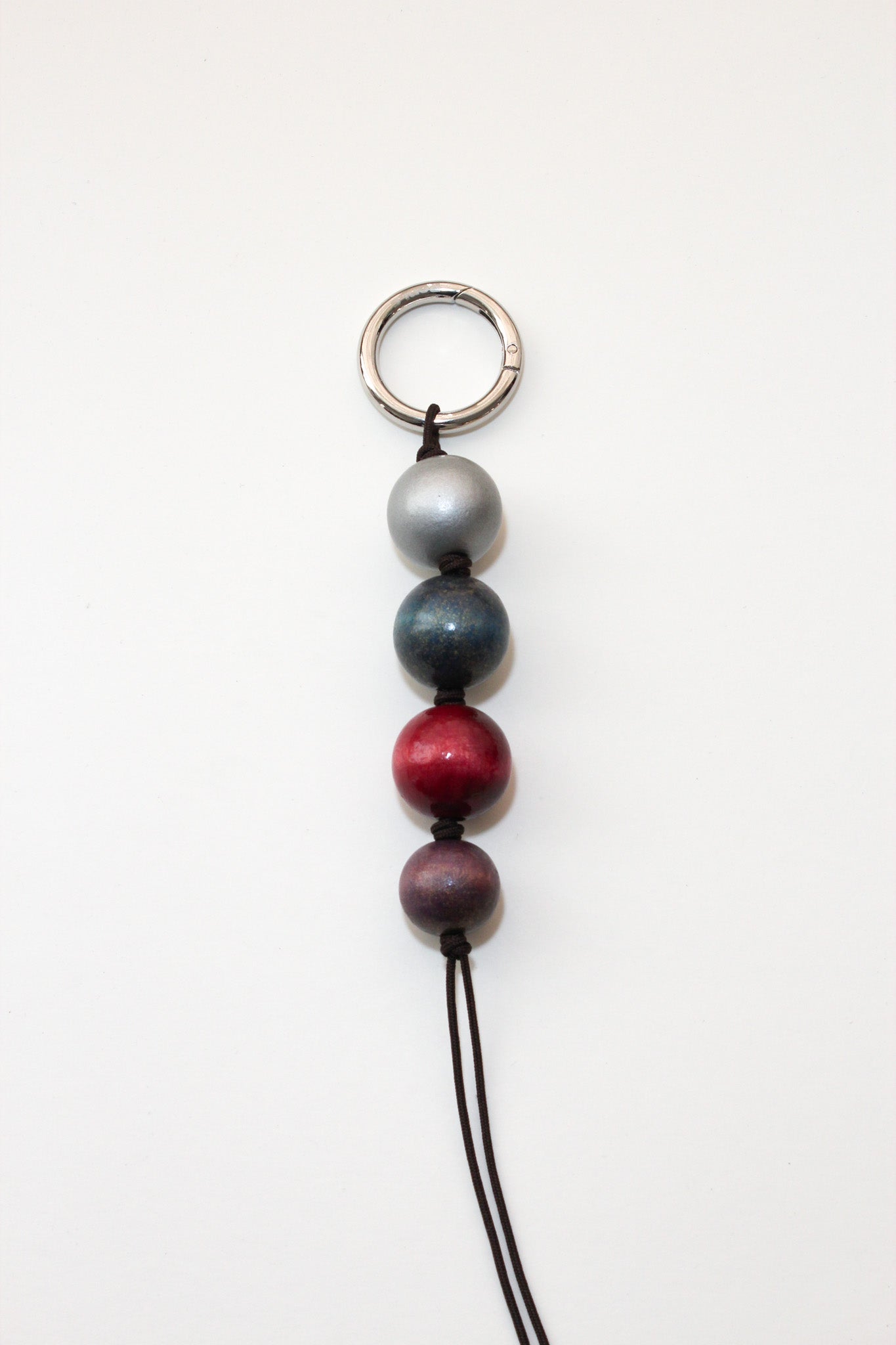 Glazed wooden ball charm