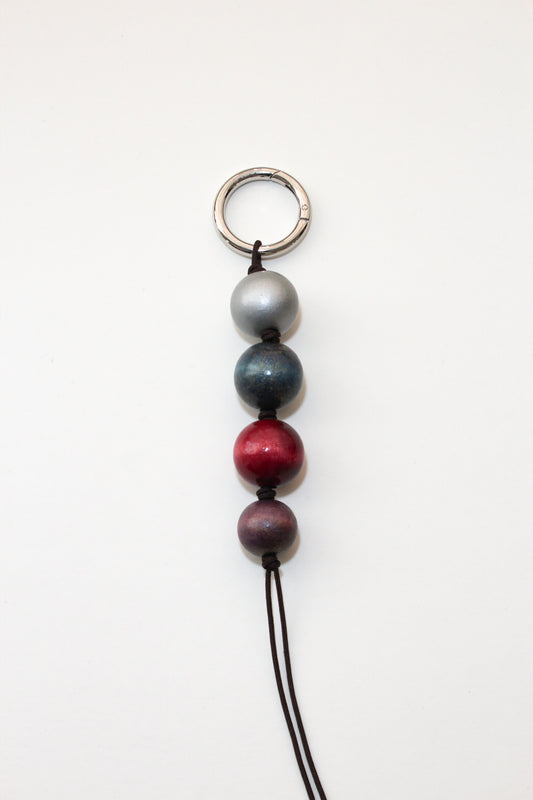 Glazed wooden ball charm